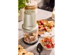 A Silvercrest mini chopper filled with nuts and oats, next to a bowl of muesli.