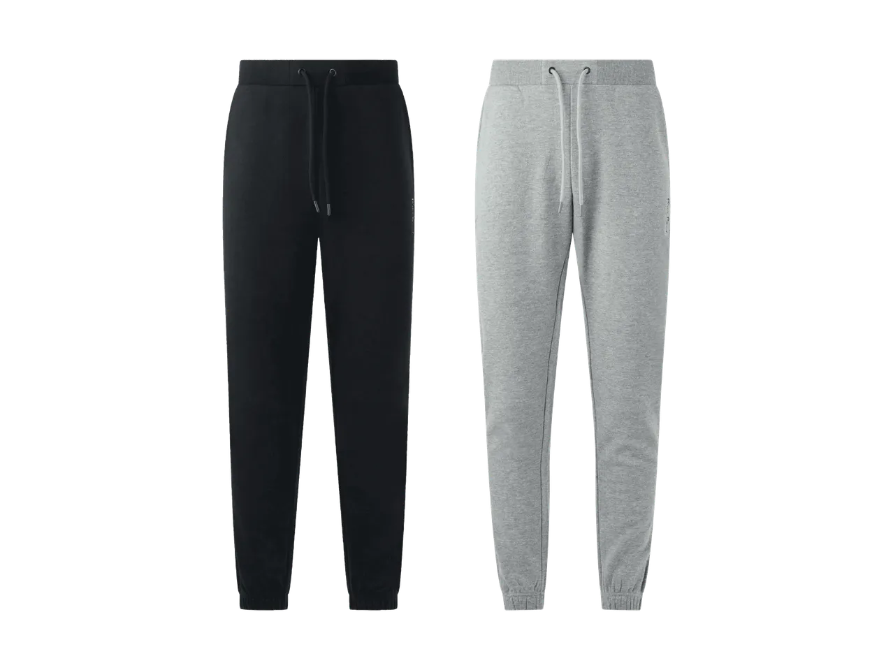 Deux pantalons de jogging, un noir et un gris, avec cordon de serrage à la taille.