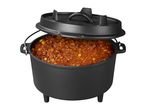 Cast iron Dutch oven with lid, filled with chili con carne, on a white background.