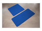 Two blue anti-slip bath mats with a wavy pattern on a tiled floor.