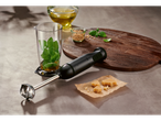 A SILVERCREST® hand blender set with ingredients for pesto, including basil, pine nuts, olive oil, and Parmesan cheese.