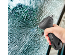 Hand holding a 5-in-1 tyre pressure gauge against a shattered car window