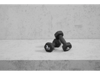 Two 3kg Crivit dumbbells on a concrete surface.