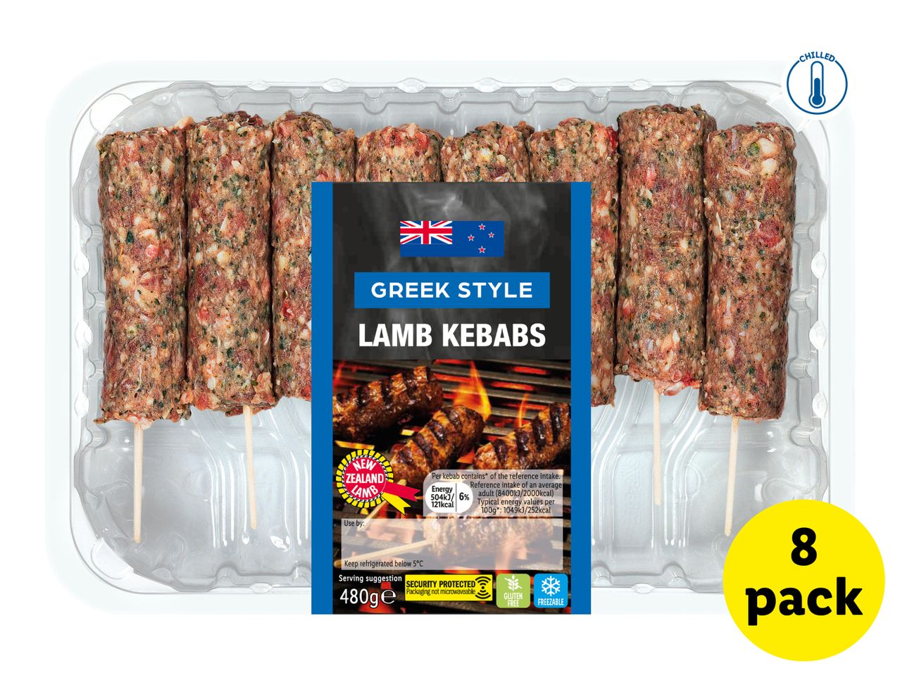 Eight raw Greek-style lamb kebabs in a clear plastic tray, with a label showing grilled kebabs.