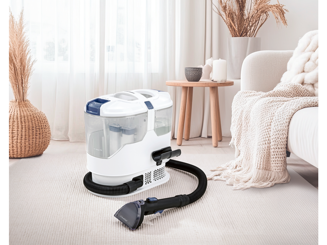 Carpet cleaner on a light rug in a bright living room with natural decor.
