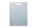 Light blue speckled plastic cutting board with a handle cutout
