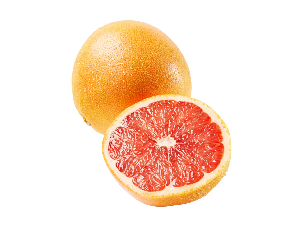 Whole and half red grapefruit with water droplets