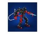 Black and red robot toy with a blue sword and a white whip on a blue background.