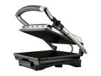 Open electric grill with ribbed cooking plates and a stainless steel handle.