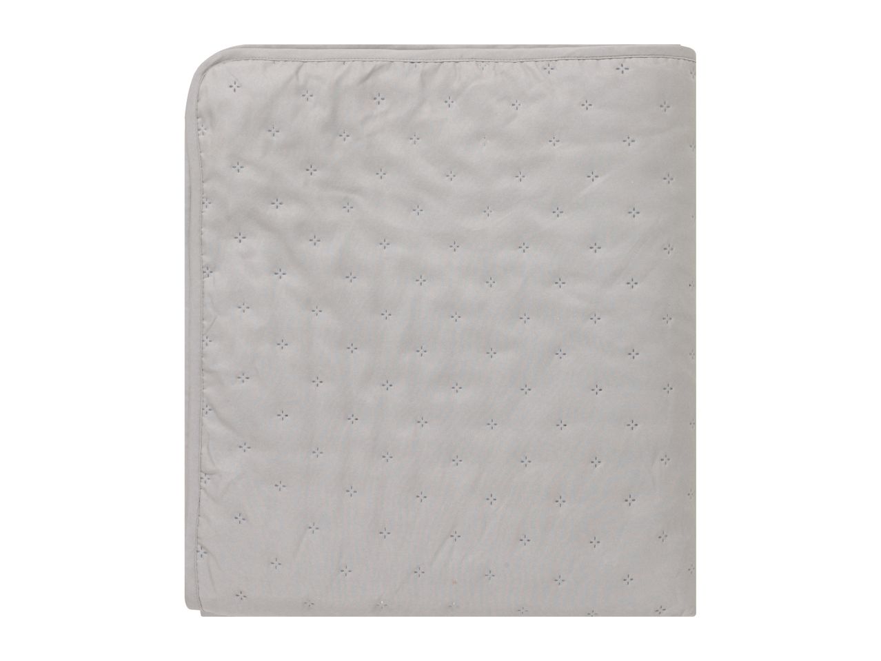 Light gray quilted blanket with small embroidered star patterns