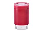 Red rectangular spice grinder with a clear base and top