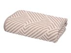 Folded beige and white patterned towel