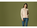 Woman in a beige fleece jacket and jeans.