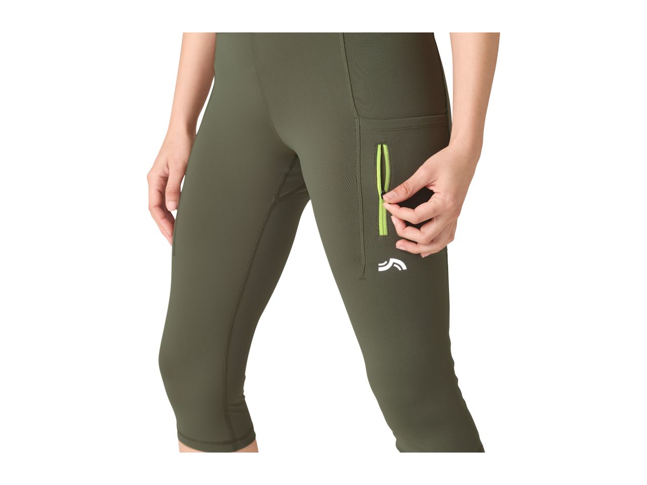 Woman in olive green capri leggings with a neon green zippered pocket.