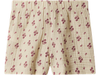 Cream-colored shorts with a delicate purple floral pattern and an elasticated waist.