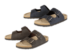 Zwei Paar dunkelblaue und dunkelgraue Birkenstock-Sandalen aus Veloursleder.