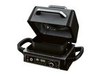 Open multi-cooker with digital display showing 180°C and 00:00, and cooking functions.
