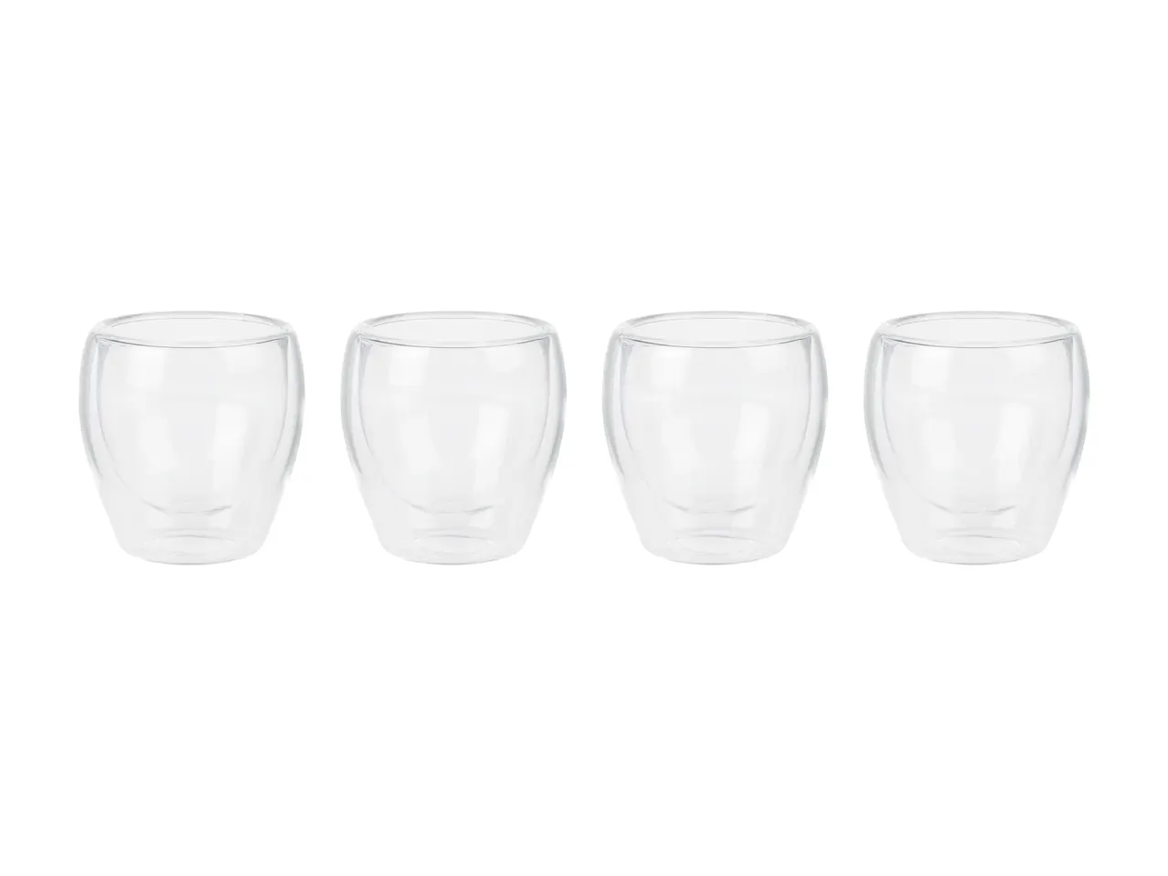 Four empty double-walled glass cups sit in a row.