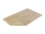 A beige bath mat with a textured surface is shown at a slight angle.