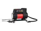 A portable, black and red air compressor with digital display and various attachments.