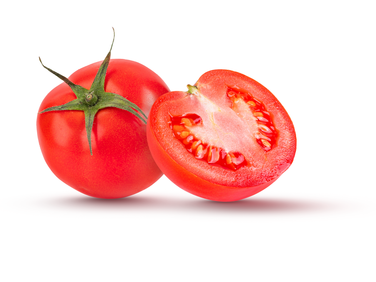 Two red tomatoes, one whole and one sliced in half, on a white background.