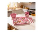 Pink children's dining set with cartoon dog characters on a kitchen table.