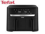 Black dual air fryer with digital display showing 200C and 140C temperatures, and cooking icons.