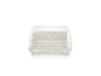 A clear plastic box filled with many small white electrical connectors.