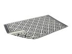 Grey and white geometric pattern outdoor rug, folded