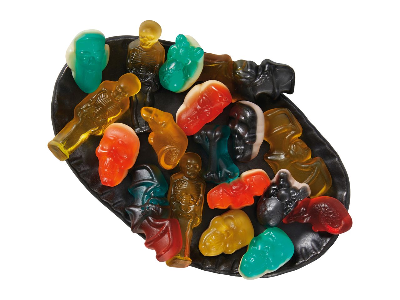 A selection of Halloween-themed gummy sweets on a black plate.