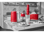 Red Silvercrest kitchen appliances, including a toaster, kettle, and blender, on a kitchen counter.