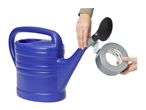 A person using duct tape to attach a shower head to the spout of a blue watering can.