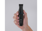 Remington G2 hair clipper in hand.