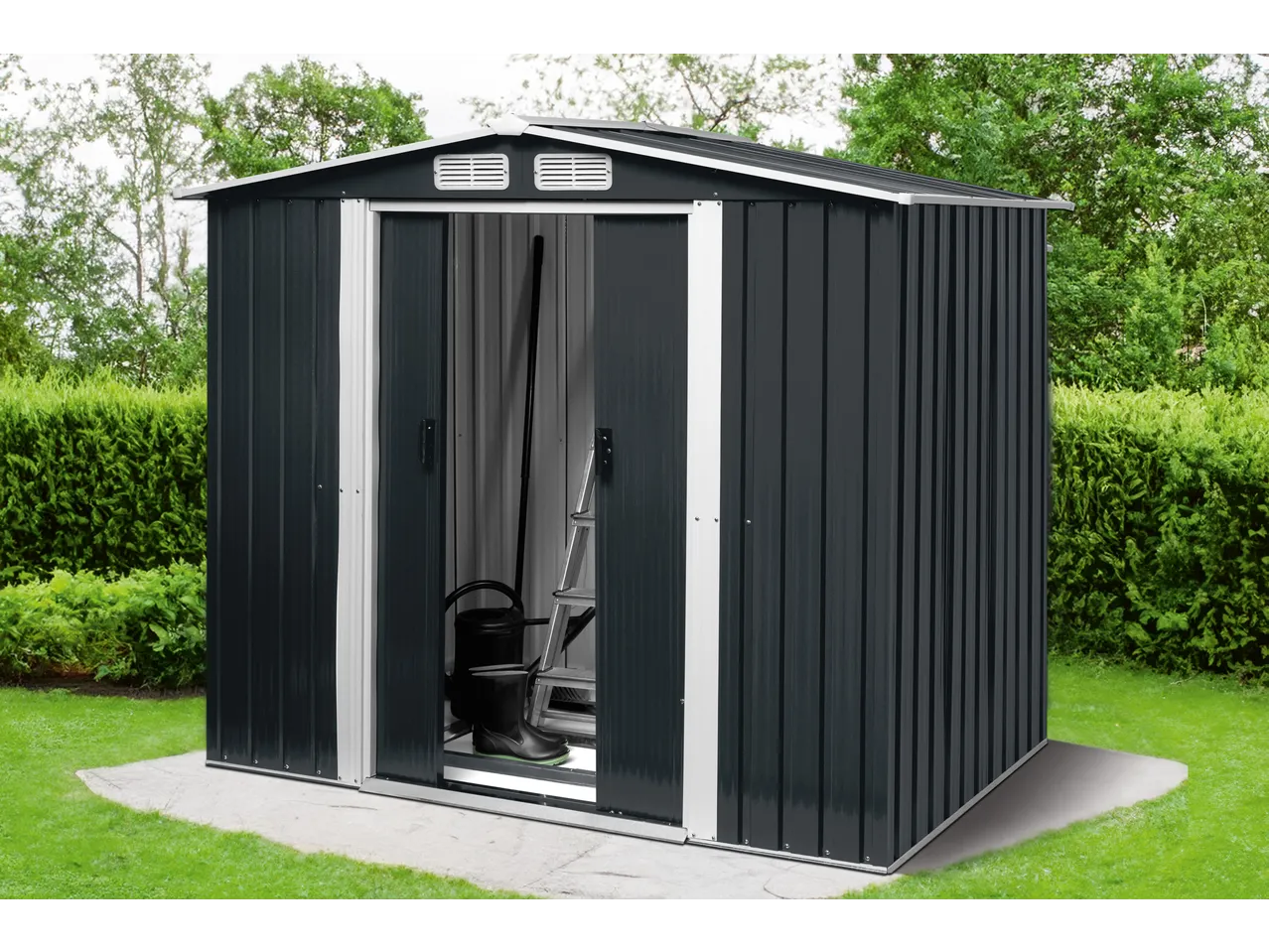 Dark grey metal garden shed with open doors, revealing gardening tools inside, on a concrete slab in a green garden.