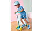 Lupilu boy in blue Paw Patrol outfit and helmet, riding a Tri-Scooter with LED wheels.