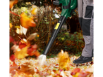 A man uses a Parkside® leaf blower to clear fallen leaves.