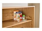 Clear storage box with pasta and spices on a wooden shelf.