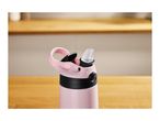Pink water bottle with a black lid and a clear straw on a wooden surface.
