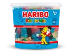 Een grote pot met gemengde fruitgums en dropjes, met een vrolijk etiket.