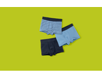 Lupilu® Kids' Boxers: Three pairs of blue and striped boxers on a lime green background.