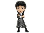 Wednesday Addams figurine in a black polka dot dress with arms crossed