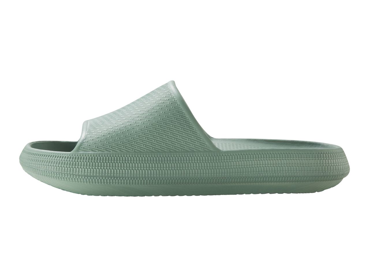 Side view of a single light green textured slide sandal with a thick sole.