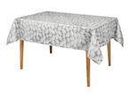 Grey tablecloth with a white fan-shaped pattern on a wooden table.