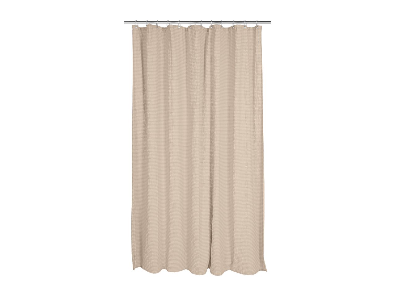 Beige shower curtain with a textured waffle weave pattern, hanging from a silver rod.