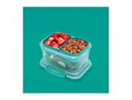 A two-compartment food storage container filled with fresh strawberries and almonds.