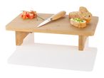 Bamboo cutting board, bread, tomatoes, knife.