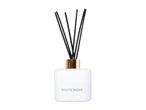 White Musk reed diffuser with a white bottle, gold collar, and black reeds