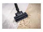 Vacuum cleaner head cleaning dirt from hard floor and carpet