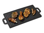 Grilled chicken breast, drumstick, sausages, and bacon-wrapped skewers on a griddle.