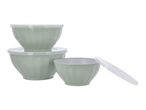 Set of three light green mixing bowls with white lids, two stacked, one open.